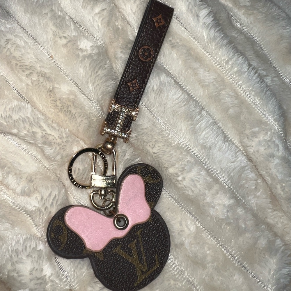 Louis Vuitton Designer Keychain with LV Designer Keychain Duster Bag.